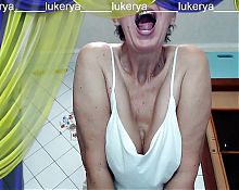 Hot housewife Lukerya cheerfully demonstrates the view of her body from below and communicates online with her fans on a